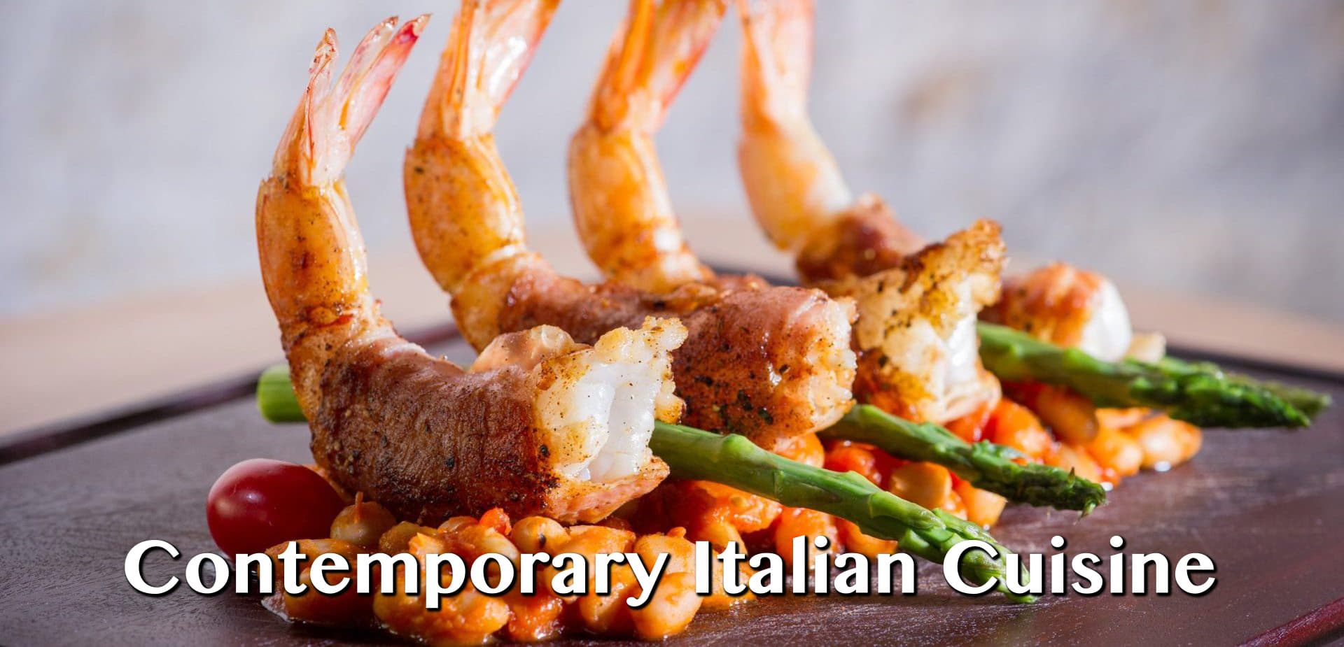 Prosciutto-wrapped shrimp over broccolini and beans at Cassariano